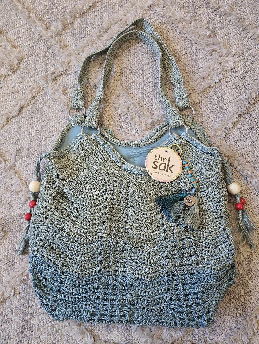 The Sak Blue Hand Crochet Hobo Shoulder Bag Tassel Zip Top Ellis Seafoam Boho